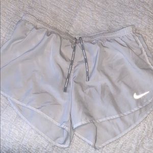 White Nike running shorts